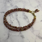 Purple Fire Polished Glass Beaded Bracelet with Gold Accents