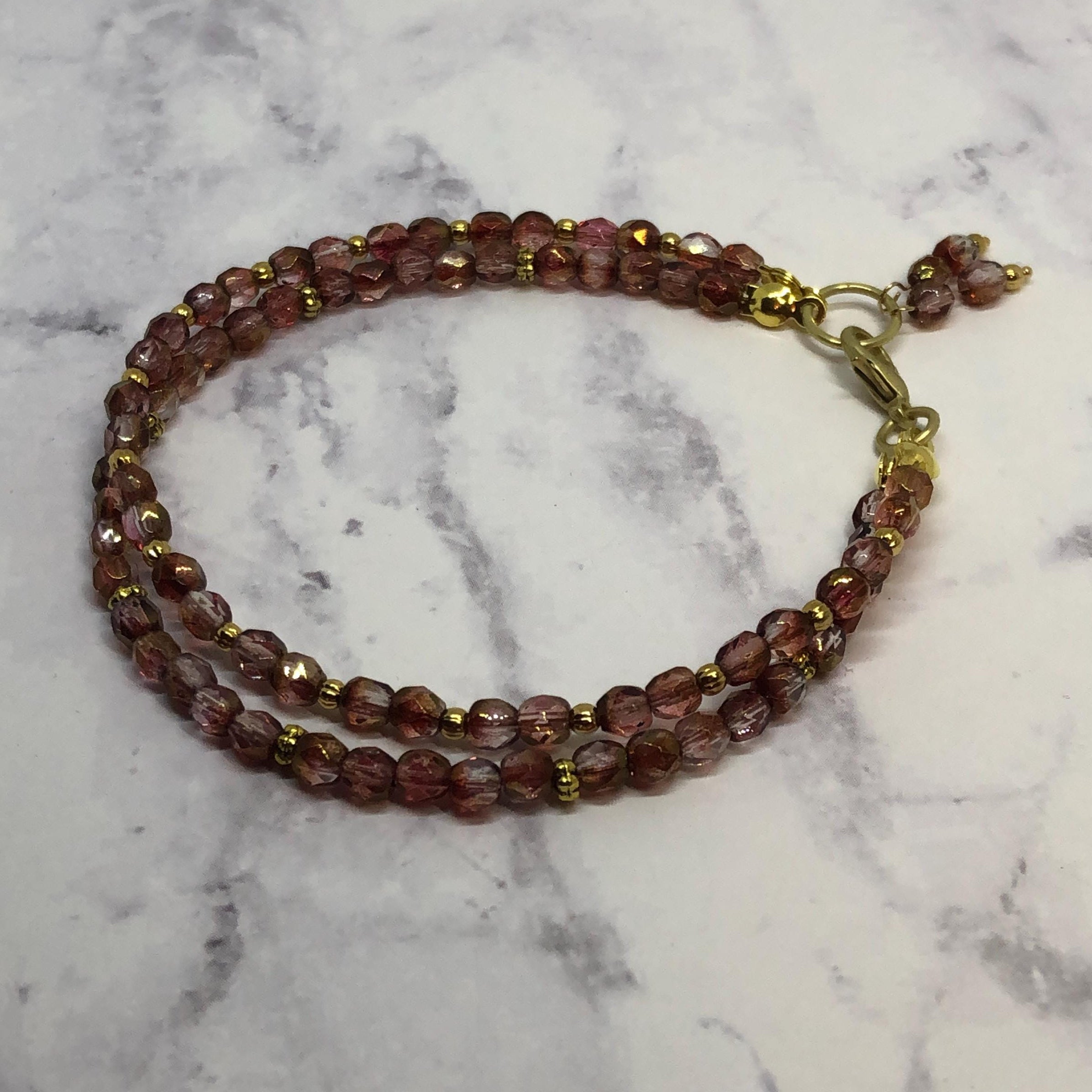 Purple Fire Polished Glass Beaded Bracelet with Gold Accents