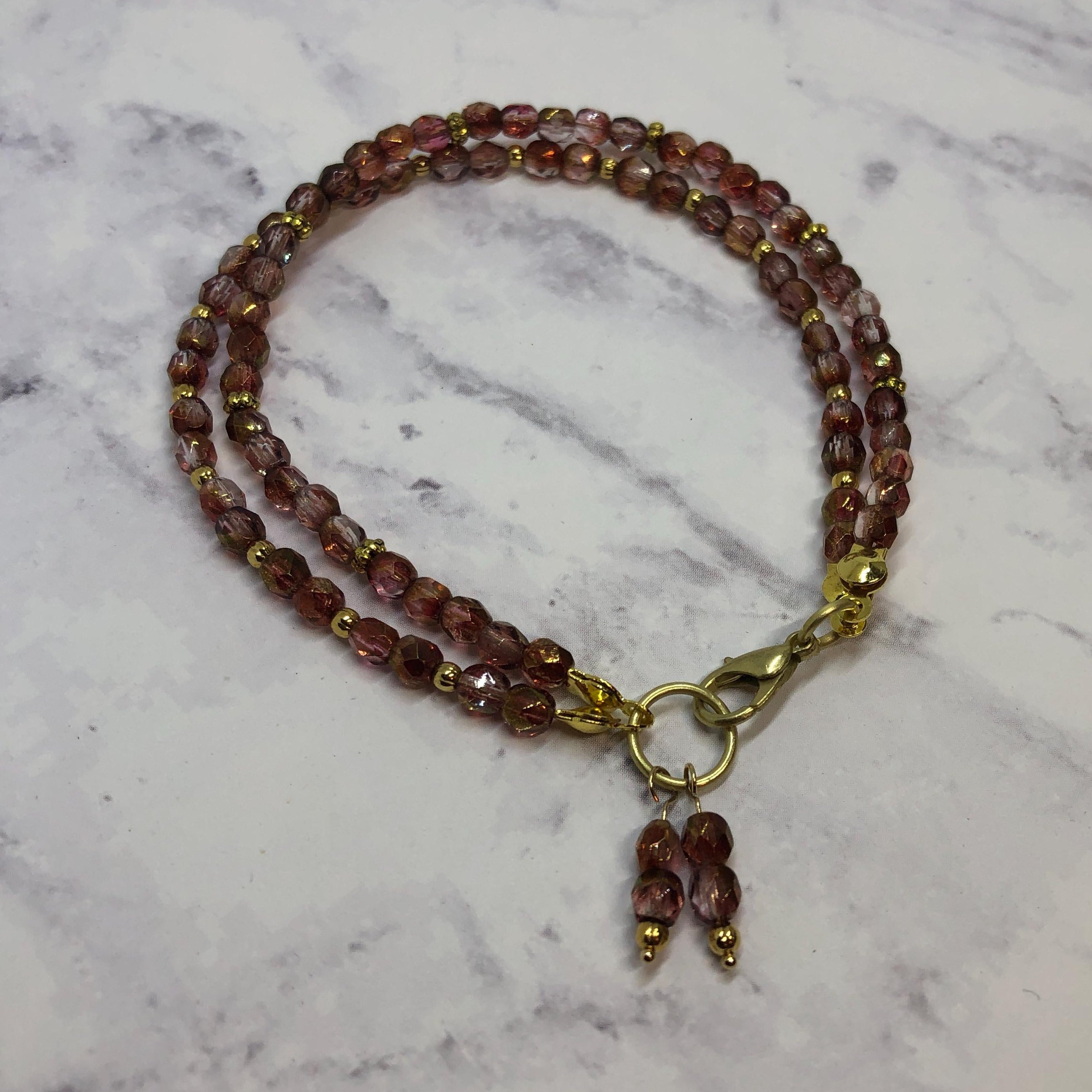 Purple Fire Polished Glass Beaded Bracelet with Gold Accents