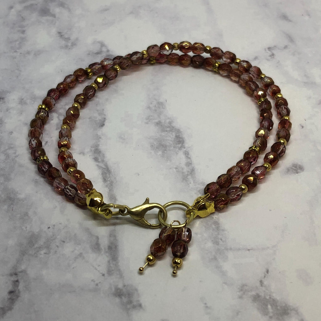 Purple Fire Polished Glass Beaded Bracelet with Gold Accents