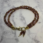 Purple Fire Polished Glass Beaded Bracelet with Gold Accents
