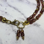 Purple Fire Polished Glass Beaded Bracelet with Gold Accents